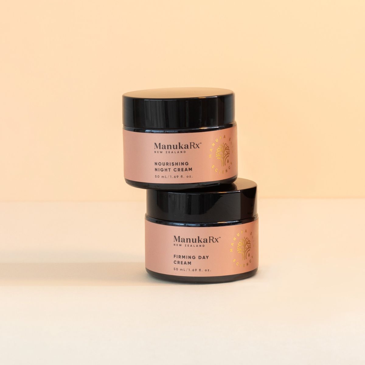 ManukaRx Firming Day Cream and Nourishing Night Cream jars stacked on top of each other