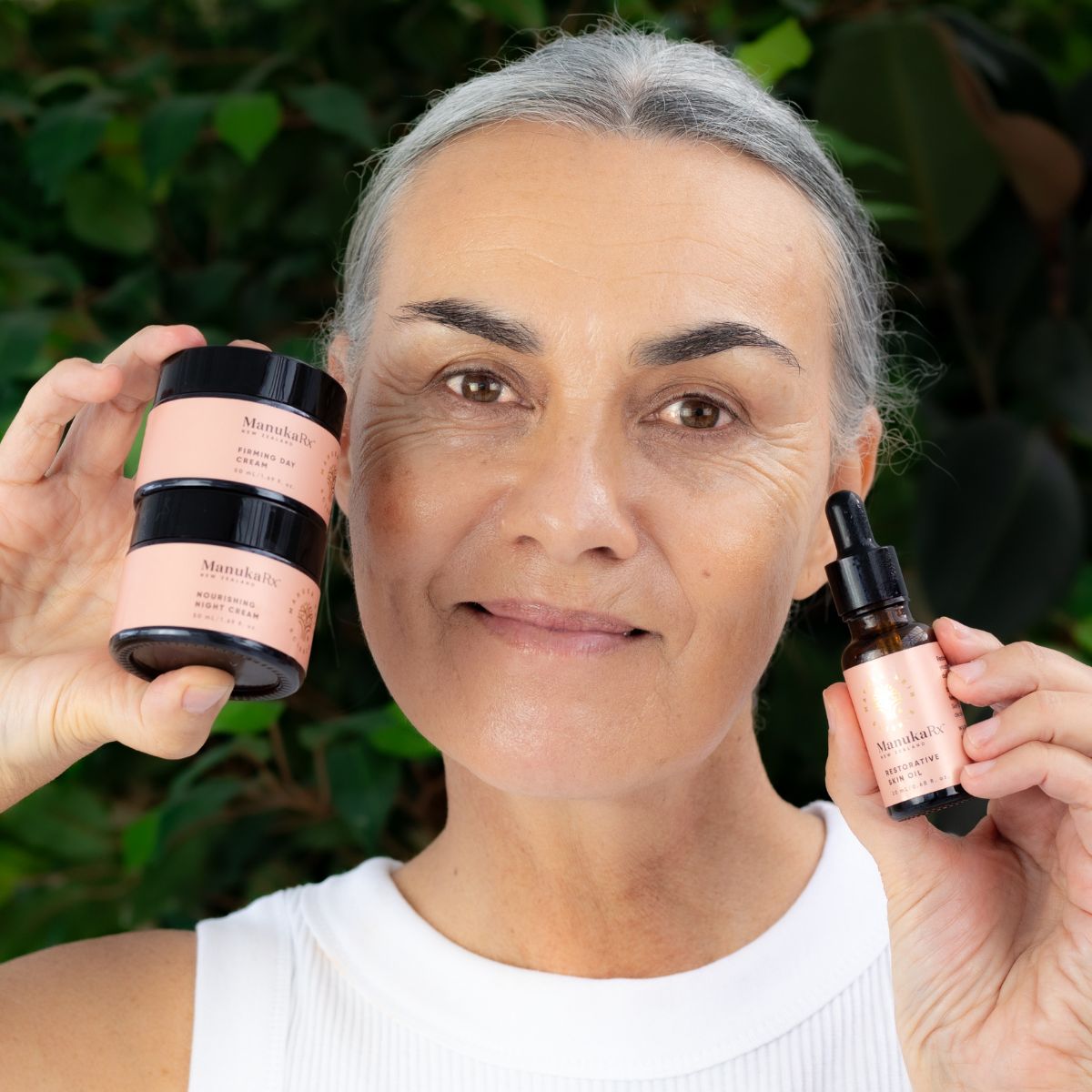 Image of a woman holding the Restorative Trio