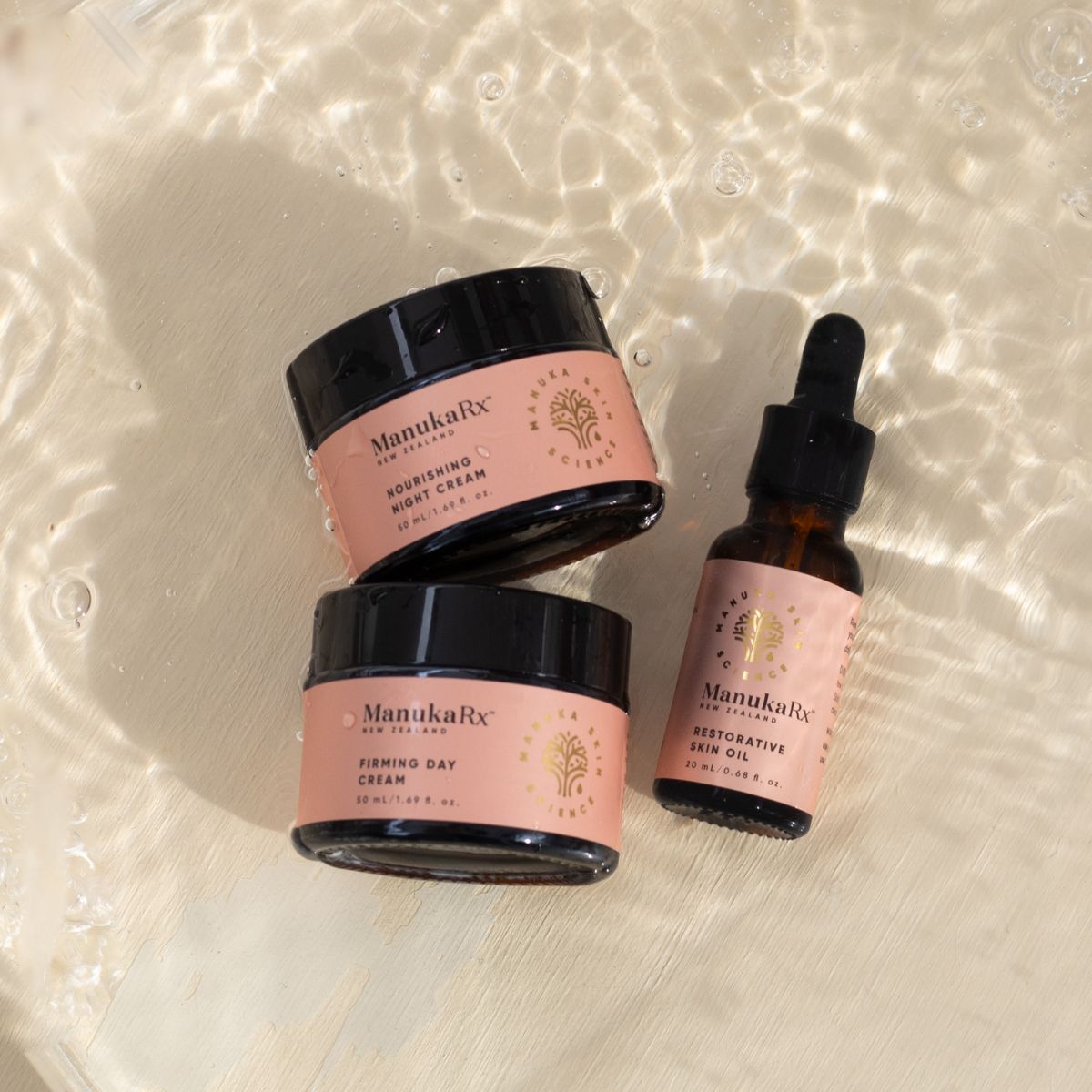 ManukaRx Restorative Trio set lying in water