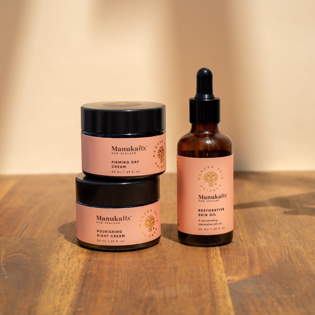 ManukaRx Restorative Trio set on a wood background