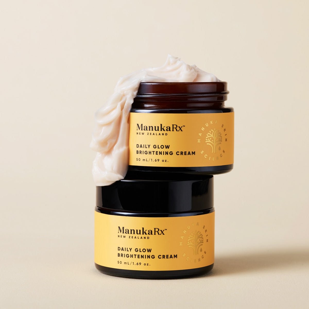 2 jars of ManukaRx Vitamin C Daily Glow Brightening Moisturiser stacked on top of each other
