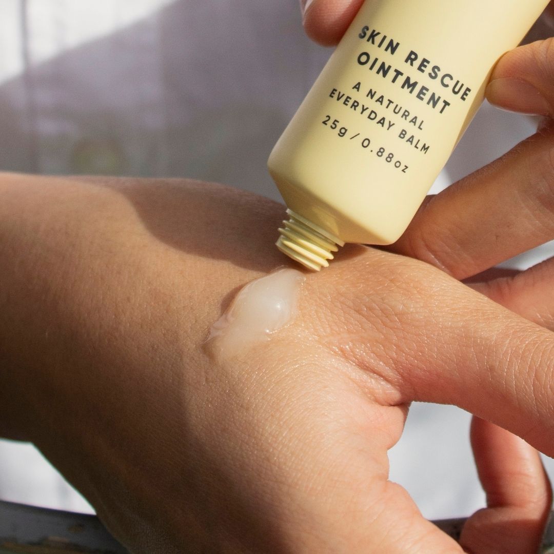 ManukaRx Skin Rescue Ointment product being applied to hand area