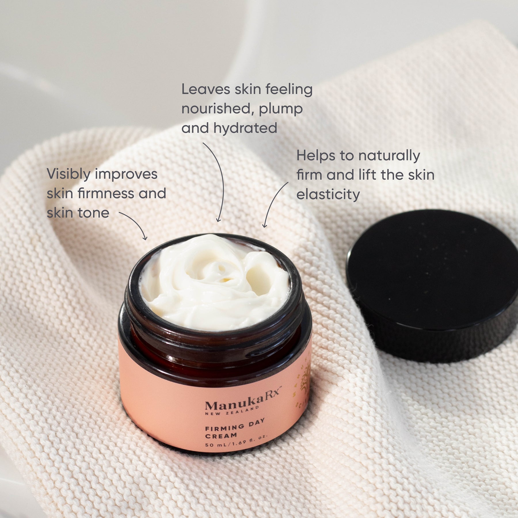 ManukaRx Firming Day Cream product benefits listed around jar of opened product